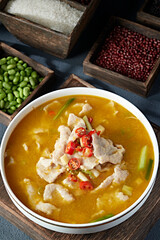 Boiled pork slices in sour soup with pepper and sesame