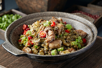 Double peppers, preserved vegetables and pork intestines in stone pot