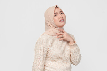 An Asian Muslim woman feels so thirsty because of the hot weather during the summer season.