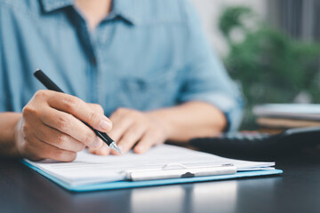 Businessman hands stamp approve on financial business approval document paper. Man hand accepted...