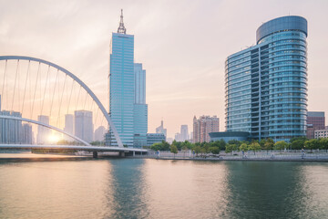 Obraz premium The urban architectural skyline, modern bridges, and Haihe River scenery of Tianjin, China on August 11, 2024