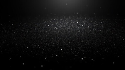 Fototapeta premium A dark background with black glitter glitter scattered across, creating a sparkling effect.