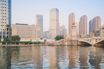 Obraz premium The urban architectural skyline, modern bridges, and Haihe River scenery of Tianjin, China on August 11, 2024 