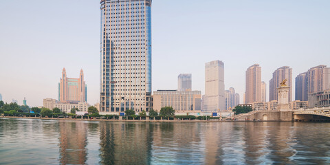 Fototapeta premium The urban architectural skyline, modern bridges, and Haihe River scenery of Tianjin, China on August 11, 2024 