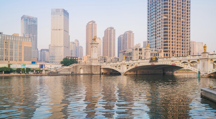 Fototapeta premium The urban architectural skyline, modern bridges, and Haihe River scenery of Tianjin, China on August 11, 2024 