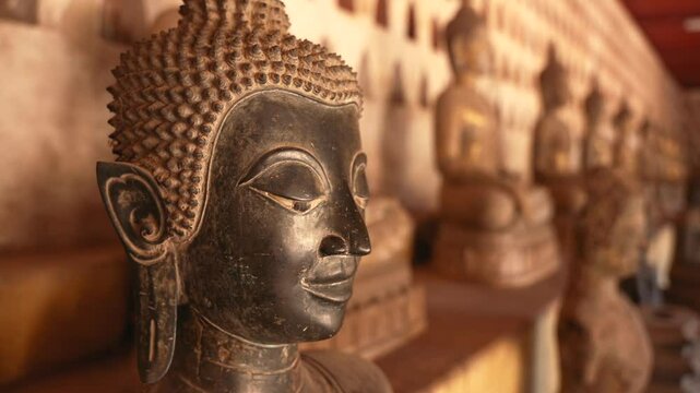 Bronze Buddha statue with serene expression in Wat Sisaket