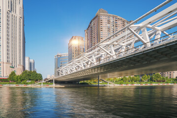 Obraz premium The urban architectural skyline, modern bridges, and Haihe River scenery of Tianjin, China on August 11, 2024