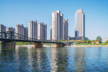Fototapeta premium The urban architectural skyline, modern bridges, and Haihe River scenery of Tianjin, China on August 11, 2024