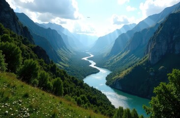 Obraz premium Majestic mountain valley with serene river and lush greenery under a clear sky