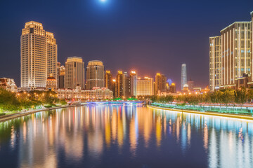 Fototapeta premium The urban architectural skyline, modern bridges, and Haihe River night scenery of Tianjin, China on August 11, 2024