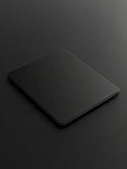 Sleek black tablet device mockup lying on a dark textured surface