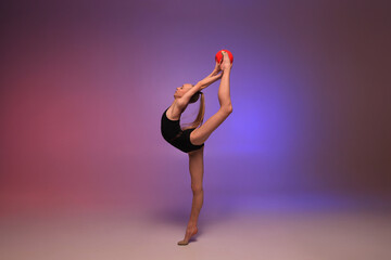 Rhythmic gymnastics girl. Colourful background.