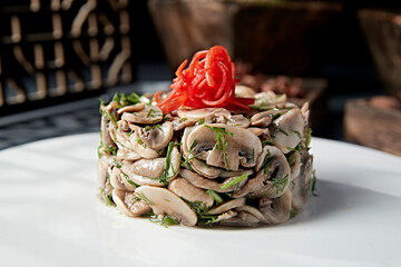 Fine cold dish: pickled mushrooms and white mushrooms with fennel and minced pork