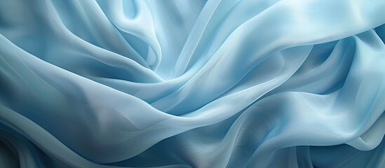 Obraz premium Soft pastel blue silk fabric with flowing folds and gentle sheen, ideal for elegant backgrounds and promotional materials, featuring a smooth texture.