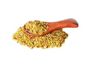 Bee pollen grains in wooden spoon isolated on white background.