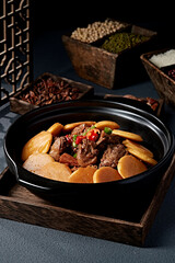 Braised chicken in casserole with corn pancakes