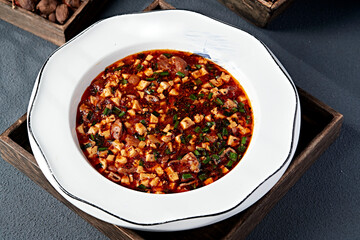 Local stir-fried spicy pork intestines, chives and tofu