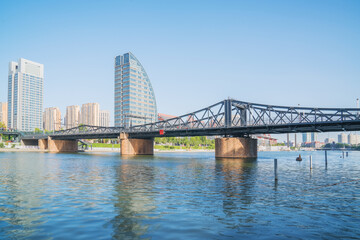 Obraz premium The urban architectural skyline, modern bridges, and Haihe River scenery of Tianjin, China on August 11, 2024