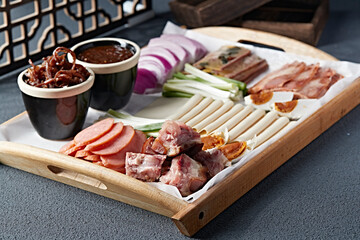 A large platter of braised meat dishes and pickles