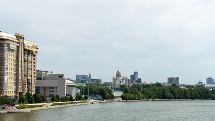 Central city pond in Yekaterinburg, Russia. Church on Blood in Honour of All Saints Resplendent in the Russian Land on embankment of the pond