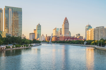 Fototapeta premium The urban architectural skyline, modern bridges, and Haihe River scenery of Tianjin, China on August 11, 2024