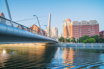 Fototapeta premium The urban architectural skyline, modern bridges, and Haihe River scenery of Tianjin, China on August 11, 2024