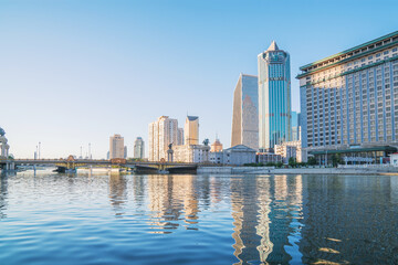 Naklejka premium The urban architectural skyline, modern bridges, and Haihe River scenery of Tianjin, China on August 11, 2024