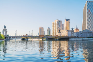 Obraz premium The urban architectural skyline, modern bridges, and Haihe River scenery of Tianjin, China on August 11, 2024