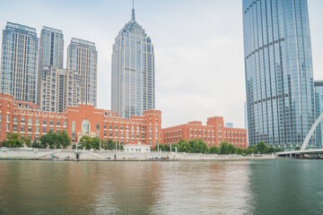 Obraz premium The urban architectural skyline, modern bridges, and Haihe River scenery of Tianjin, China on August 11, 2024