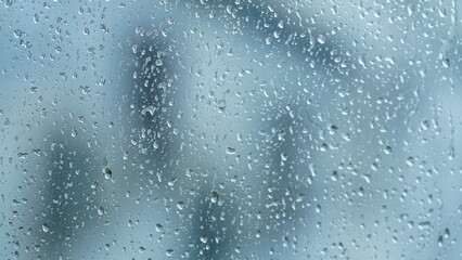 The glass window view full of the water droplets in the rainy day