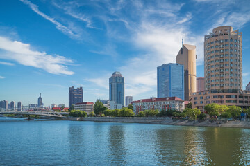 Obraz premium The urban architectural skyline, modern bridges, and Haihe River scenery of Tianjin, China on August 11, 2024
