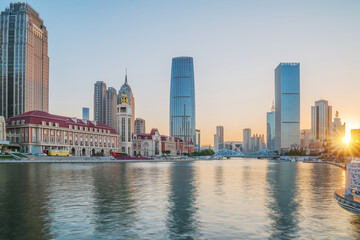 Naklejka premium The urban architectural skyline, modern bridges, and Haihe River scenery of Tianjin, China on August 11, 2024