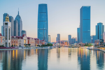 Obraz premium The urban architectural skyline, modern bridges, and Haihe River scenery of Tianjin, China on August 11, 2024