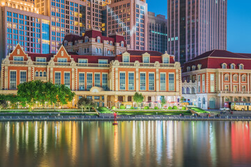 The urban architectural skyline, modern bridges, and Haihe River night scenery of Tianjin, China on August 11, 2024