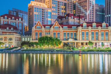 Obraz premium The urban architectural skyline, modern bridges, and Haihe River night scenery of Tianjin, China on August 11, 2024