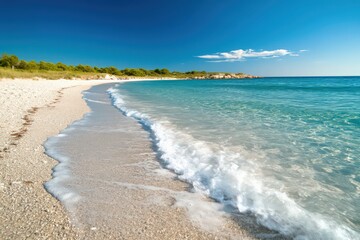 Stunning Turquoise Water Lapping a Pebble Beach Under a Vivid Blue Sky