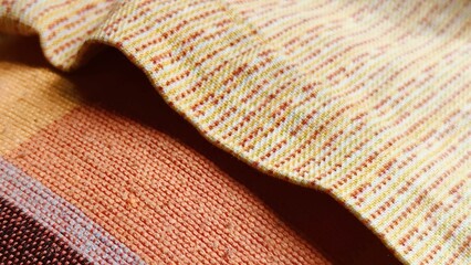 Tartan pattern on crumpled fabric. Colored lines and square pattern. Close up on checkered fabric.