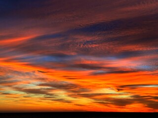 Sunset sky clouds dramatic heaven fiery glowing cloudscape. 