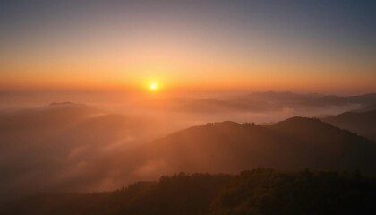 Obraz premium Golden Sunrise Over Misty Mountains