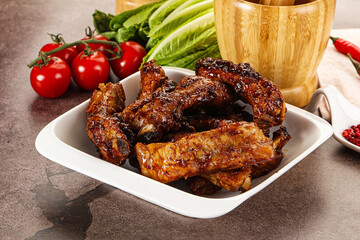 Grilled pork ribs in barbecue sauce