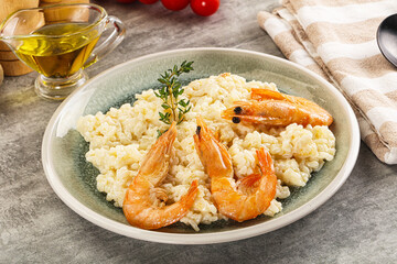 Italian risotto with prawn served thyme