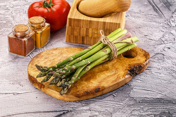 Vegan raw green asparagus heap