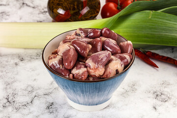 Raw chicken hearts in the bowl