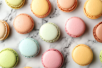 Fototapeta premium Colorful macarons arranged on a marble surface, perfect for dessert lovers.