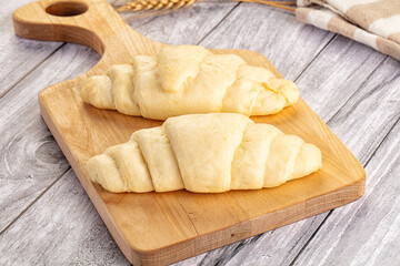 Raw uncooked croissant for bake