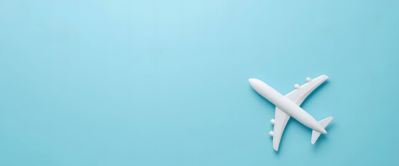 A pristine white airplane resting majestically on a soft blue background, evoking a sense of adventure and peaceful travel through the skies.
