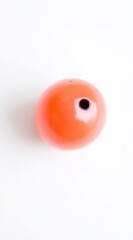 Single Bright Orange Round Object with a Black Hole in Center