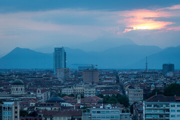 Torino landscape with the iconic Mole Antonelliana and the Intesa Sanpaolo skyscraper.