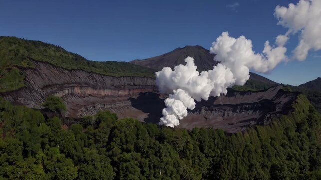 Volcanic plume billowing from mount bromo crater, emerald landscape sprawling beneath stark volcanic peaks, contrasting against vibrant azure heavens