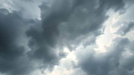 Fototapeta premium A dramatic sky filled with dark, ominous clouds, suggesting a coming storm.